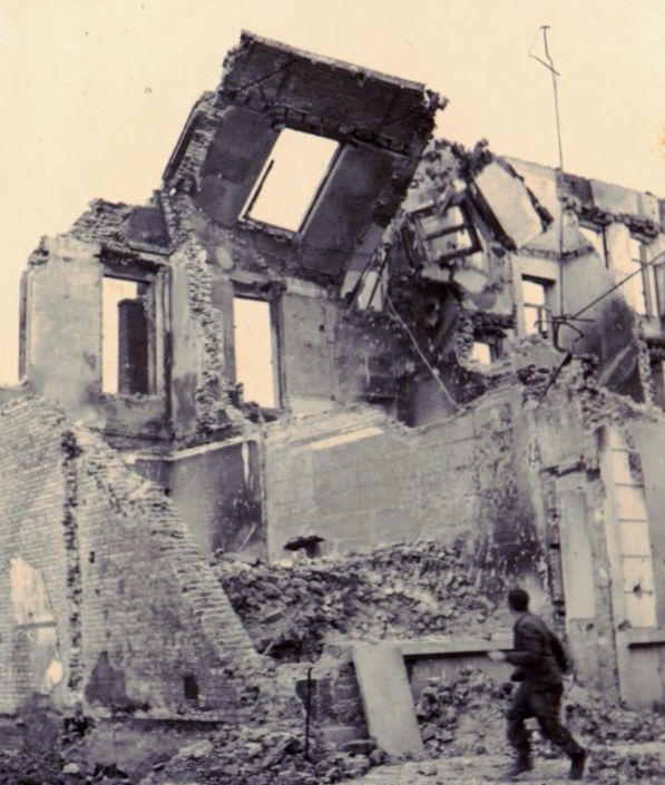 Found photo: a soldier (?) rushing out of the way of an unstable bombed-out building in what seems to be post-blitz France. Flickr.com. Retrieved July 15th, 2013, http://www.flickr.com/photos/theeerin/8515832971/